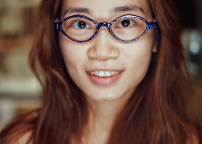 woman-in-blue-oval-glasses