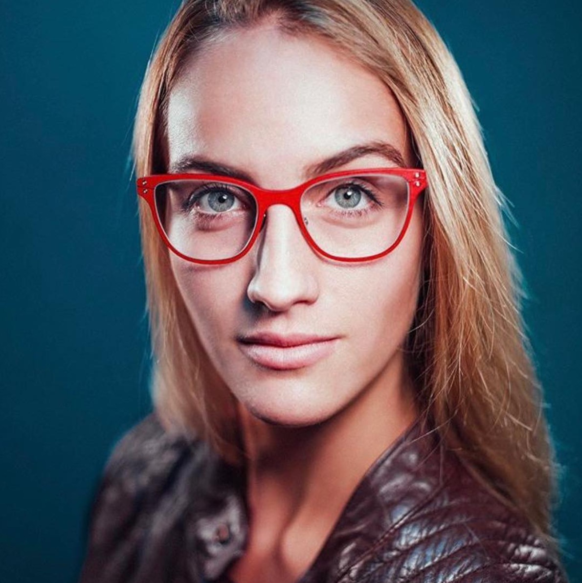 woman in red glasses