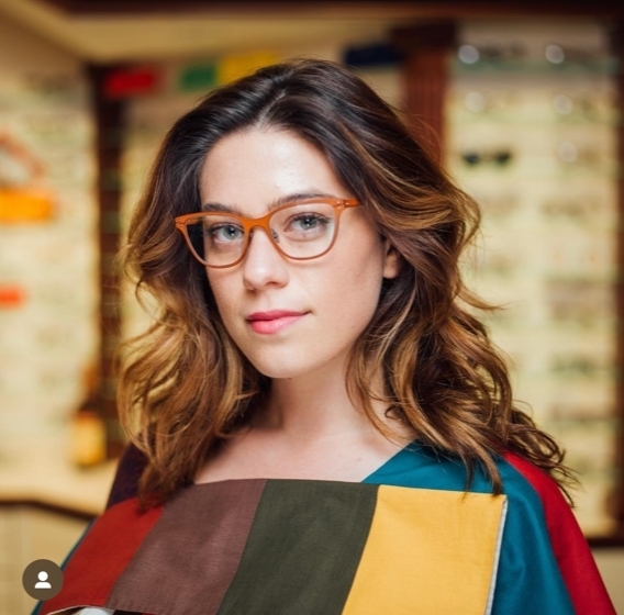 woman wearing eyeglasses with frame color analysis at 1010 optics